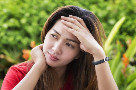 Portrait of stressed asia womanの写真素材