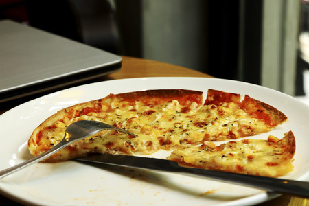 Italian pizza decorate on white dish.の写真素材