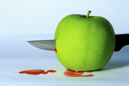 Green apple and knite.の写真素材