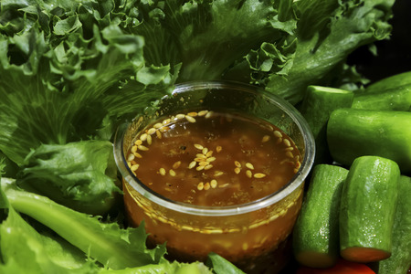 Mixed vegetables salad in black dish.の写真素材