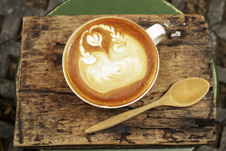 Hot mocha coffee decorated on wood background.の写真素材