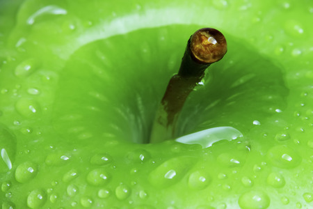 Water drops on green apple.の写真素材