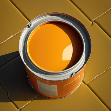 A can of yellow paint sits on a yellow-painted floor. AI generatedの写真素材