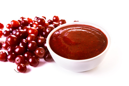 bowl with cranberry sauce isolated on white backgroundの写真素材