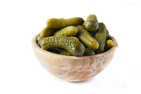 pickled cucumbers in bowl isolated on white backgroundの写真素材