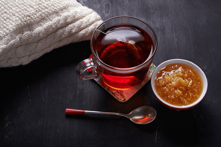 cup of tea and lemon lam on dark backgroundの写真素材