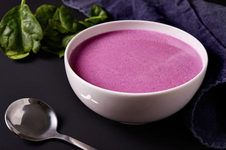 bowl of blended red cabbage soup.の写真素材