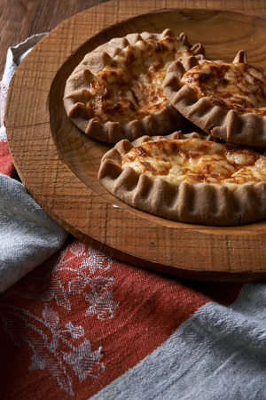 traditional karelian pie over wooden backgroundの写真素材