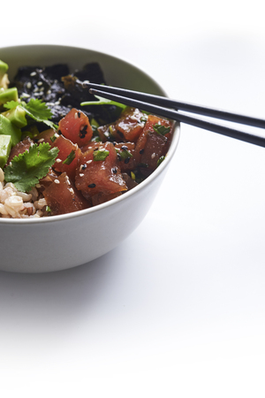 Tuna poke with avocado, wild rice and seaweed. hawaiian traditional foodの写真素材