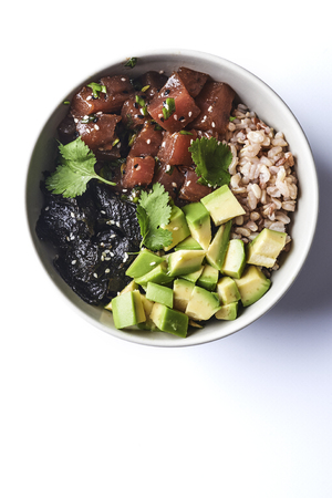 Tuna poke with avocado, wild rice and seaweed. hawaiian traditional foodの写真素材