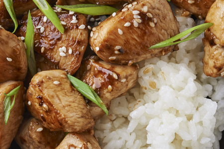 plate of teriyaki chicken and rice isolated on white backgroundの写真素材