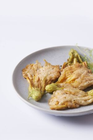 fried zucchini flowers  deep fried on plate  close upの写真素材