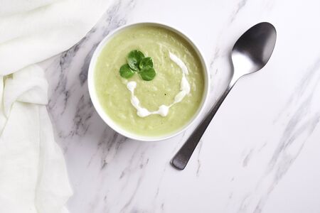 bowl with squesh cream soup on murble backgroundの写真素材