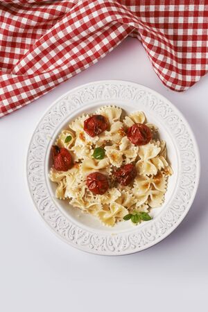 plate with pasta with roasted tomatoesの写真素材