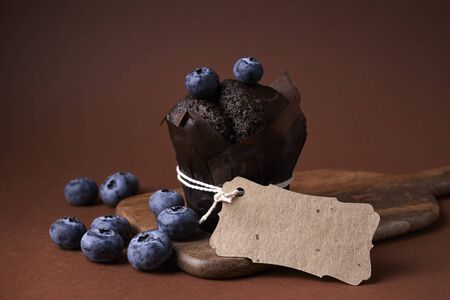 chocolate muffin with blueberry and craft tagの写真素材