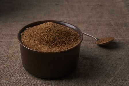 bowl with coconut sugar on burlapの写真素材