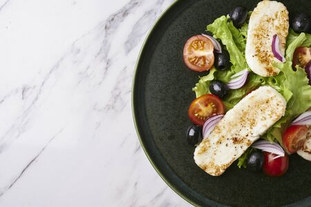 salad with roasted soft cheese and fresh vegetables
