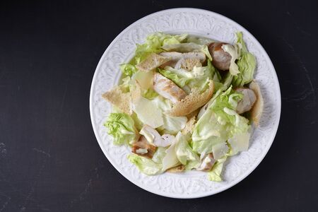 plate of caesar with grilled chicken top viewの写真素材