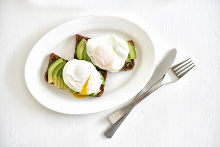 ray bread toast with avocado and egg poached