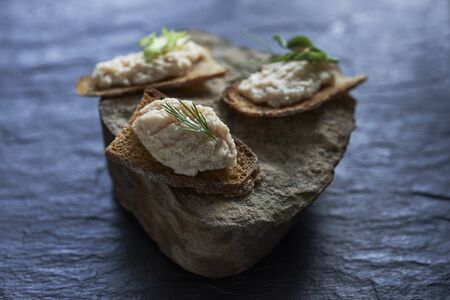 toast with roe cod on stone  background