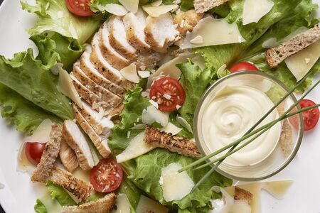 chicken salad with vegetavles and dressingの写真素材