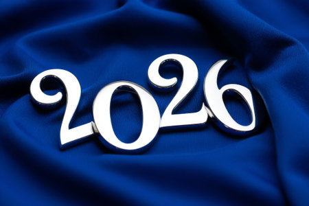 New Year's card with the number 2016 on a blue satin backgroundの素材