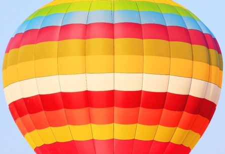 close up of colorful hot air balloon isolated on blue skyの写真素材