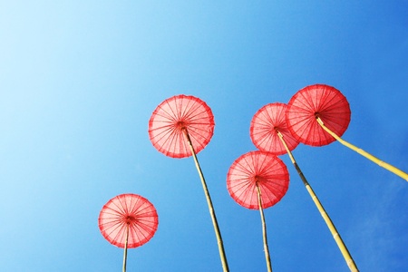 Thai traditional umbrella with clear blue skyの写真素材