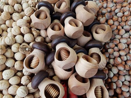 Wooden device for cracking the shells of daisies on a pile of walnuts. Riga. Latvia. February 2019.のeditorial素材