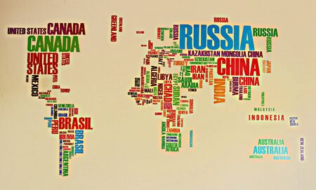 Geographic map of the world on the wall, where instead of the territory of the country its name is...