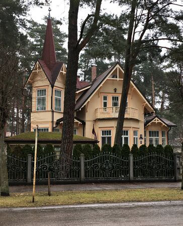 Architecture of houses built of wood, snowy, resort city of Jurmala. Latvia, spring 2018.のeditorial素材