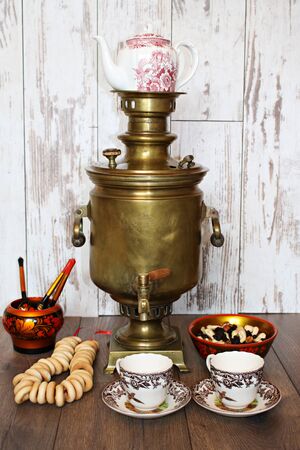 Tula copper samovar on the table and tea set for tea drinking. Latvia, March 2019.のeditorial素材