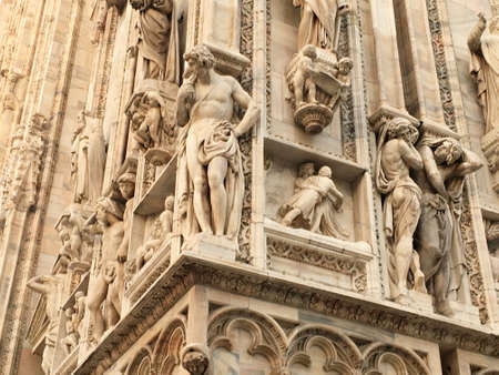 Bas reliefs and sculptures on the walls of the famous Milan Cathedral in Italy. December 2017.のeditorial素材
