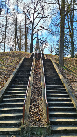 The steps of the stairs are laid on top of large hill to the Lutheran Church