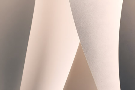 curled paper sculpture in soft beige, delicate layers and smooth texture under soft natural light, subtle shadow play, minimalist studio backdrop for product mockup and branding visuals, calm elegantの写真素材