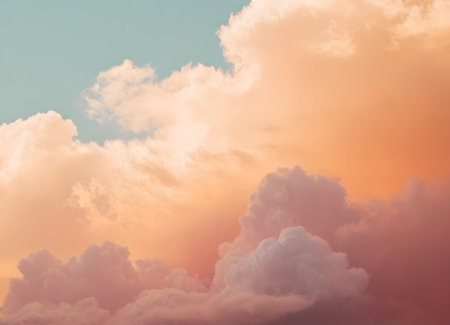 golden orange cumulus exploding at sunset, bold contrast between warm glow and cool teal sky, sand-texture matte finish and soft grain on cloud faces, majestic vivid panorama full of drama and depth.の素材