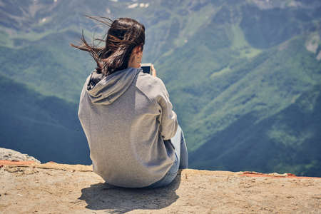 Teenager enjoying in the mountains, Teen girl spending holidays in the mountains