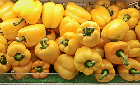 fresh peppers at vegetable marketの写真素材