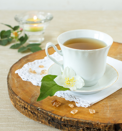 Jasmine tea with jasmine herb flower on wooden tableの写真素材