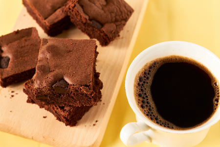 Homemade chocolate brownies with coffee, close upの写真素材