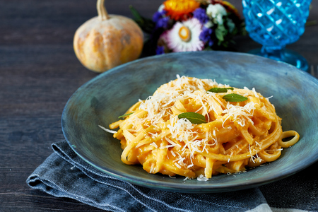 Creamy roasted butternut pumpkin pasta with parmesan cheese and sageの写真素材