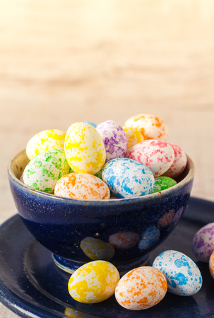 Colorful mini easter eggs in a bowl, close upの写真素材