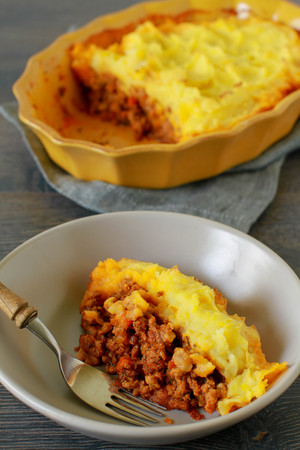 Classic homemade Shepherd's Pie in the casserole dish. Selective Focus.の写真素材