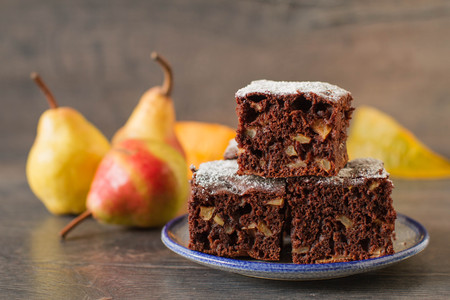 Chocolate cake with pears in rustic styleの写真素材