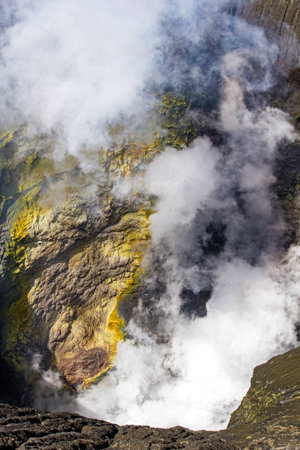 Active Bromo volcano mountain hole with sulfur gas and smokeの写真素材