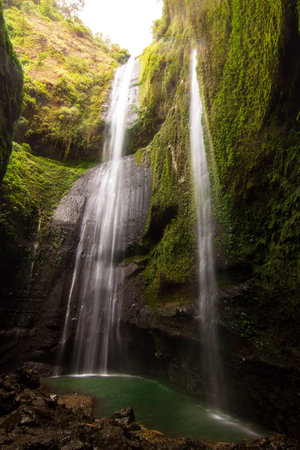 Grand waterfall from mountain cliff in Indonesiaの写真素材