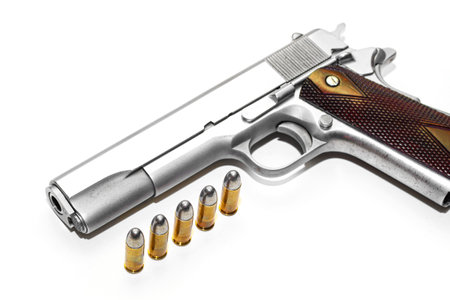 Automatic white gun stainless steel pistol weapon model m1911 with real bullet ammo head in white...