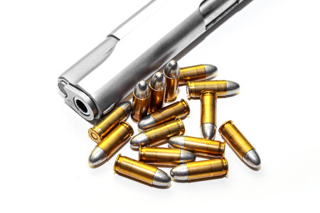 Automatic white gun stainless steel pistol weapon model m1911 with real bullet ammo head in white...