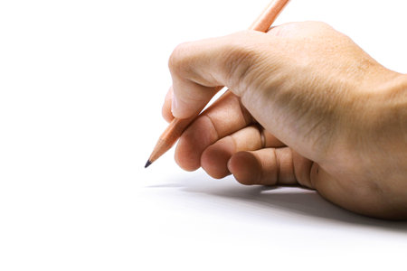 Right hand hold up brown wood pencil write on white backgroundの写真素材