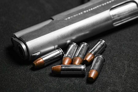 Automatic white gun stainless steel pistol weapon model m1911 with real bullet ammo head in black...